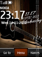 Guitar Digital Clock es el tema de pantalla